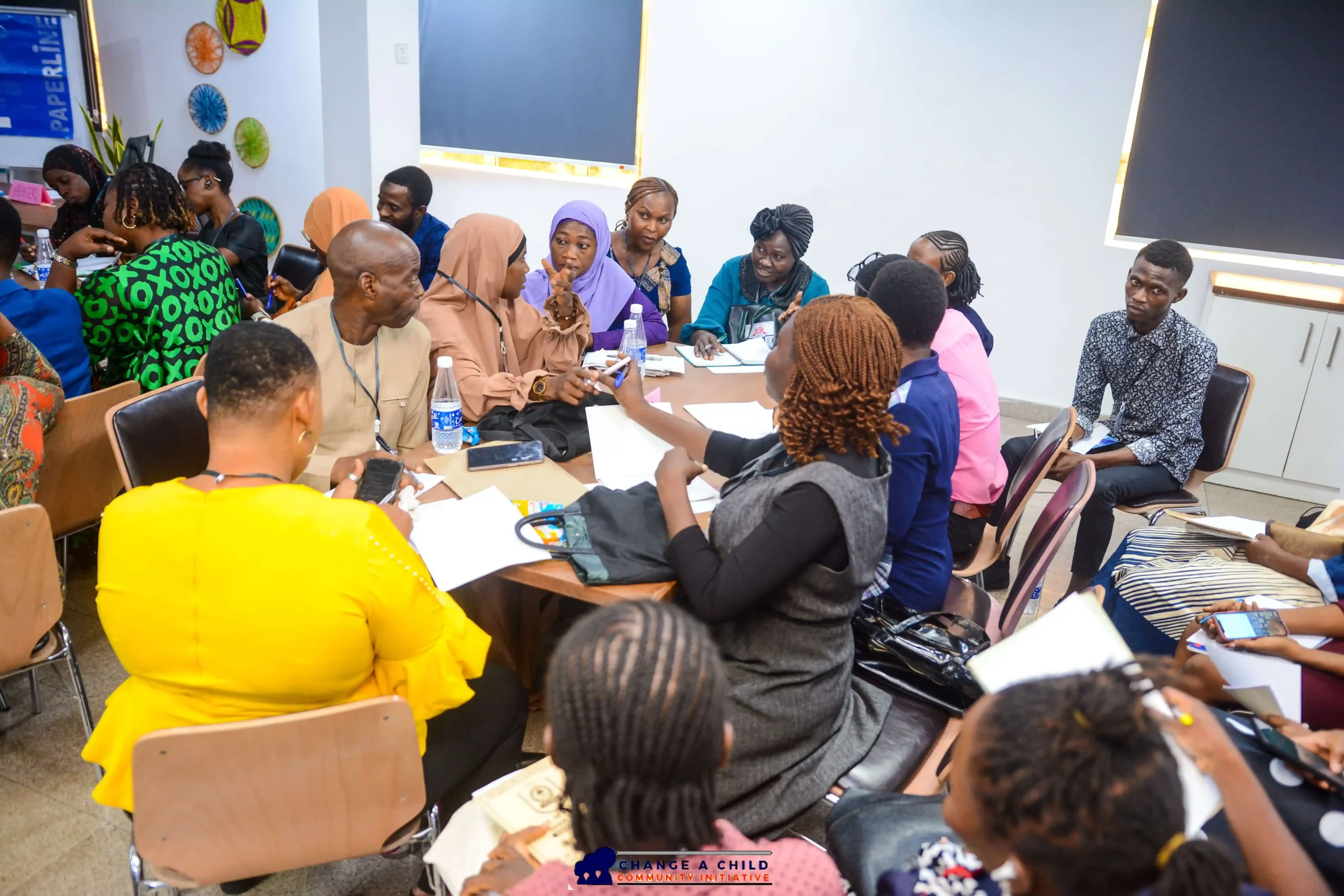 Teachers conversing with each other in a CACI Teacher Workshop
